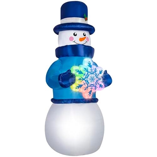 An inflatable Christmas figure on a front lawn at night
