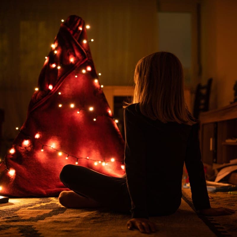 Battery-powered fairy lights wound through greenery