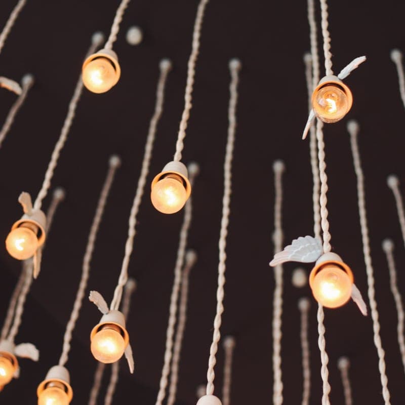 Icicle-style light drops hanging from a roof edge