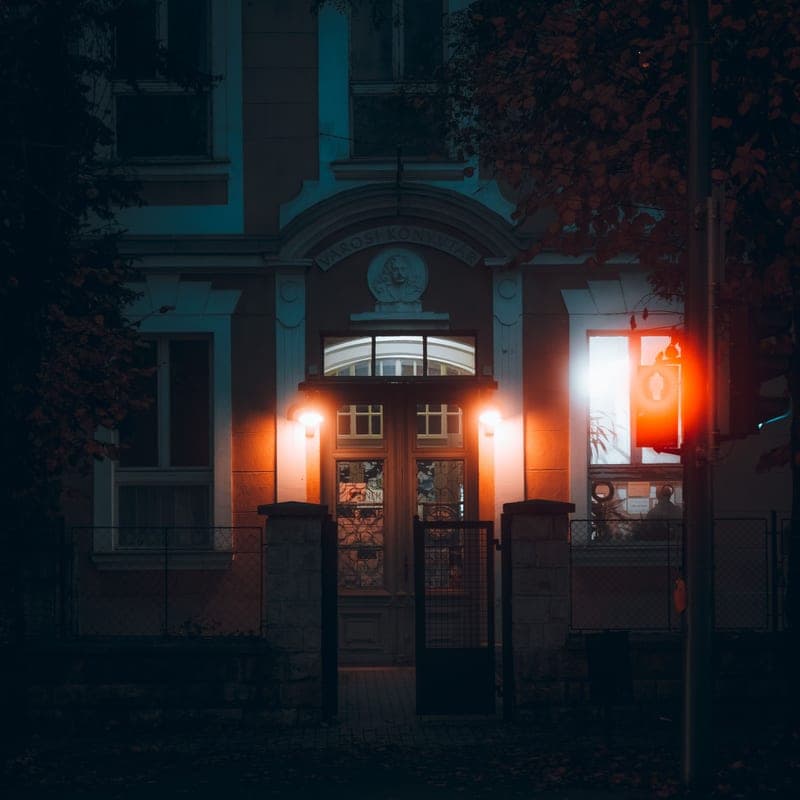 Color-changing string lights on the outside of a house